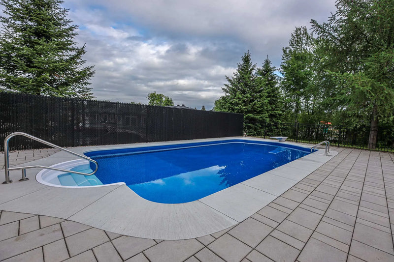 Large backyard inground pool with diving board | HB Pools