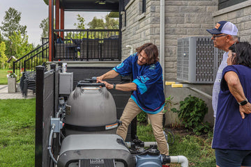 HB Pools technician inspecting and servicing pool filtration equipment for homeowners in Greely, Ontario, demonstrating expert pool maintenance and customer care.