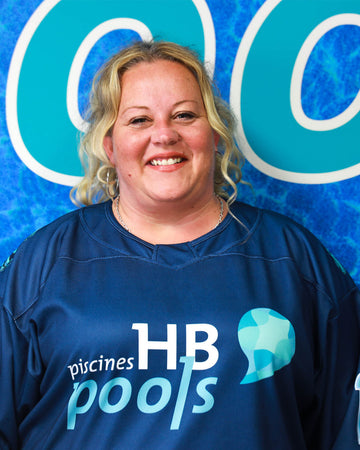 Office Staff wearing a blue Jersey with 'HB pools' logo in front of a pool-themed background