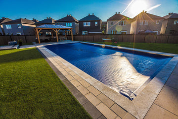 Rectagular inground pool installation with Coverstar, interlock pool surround and gazebo