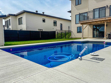 Pool view with vaccum on holding on corner