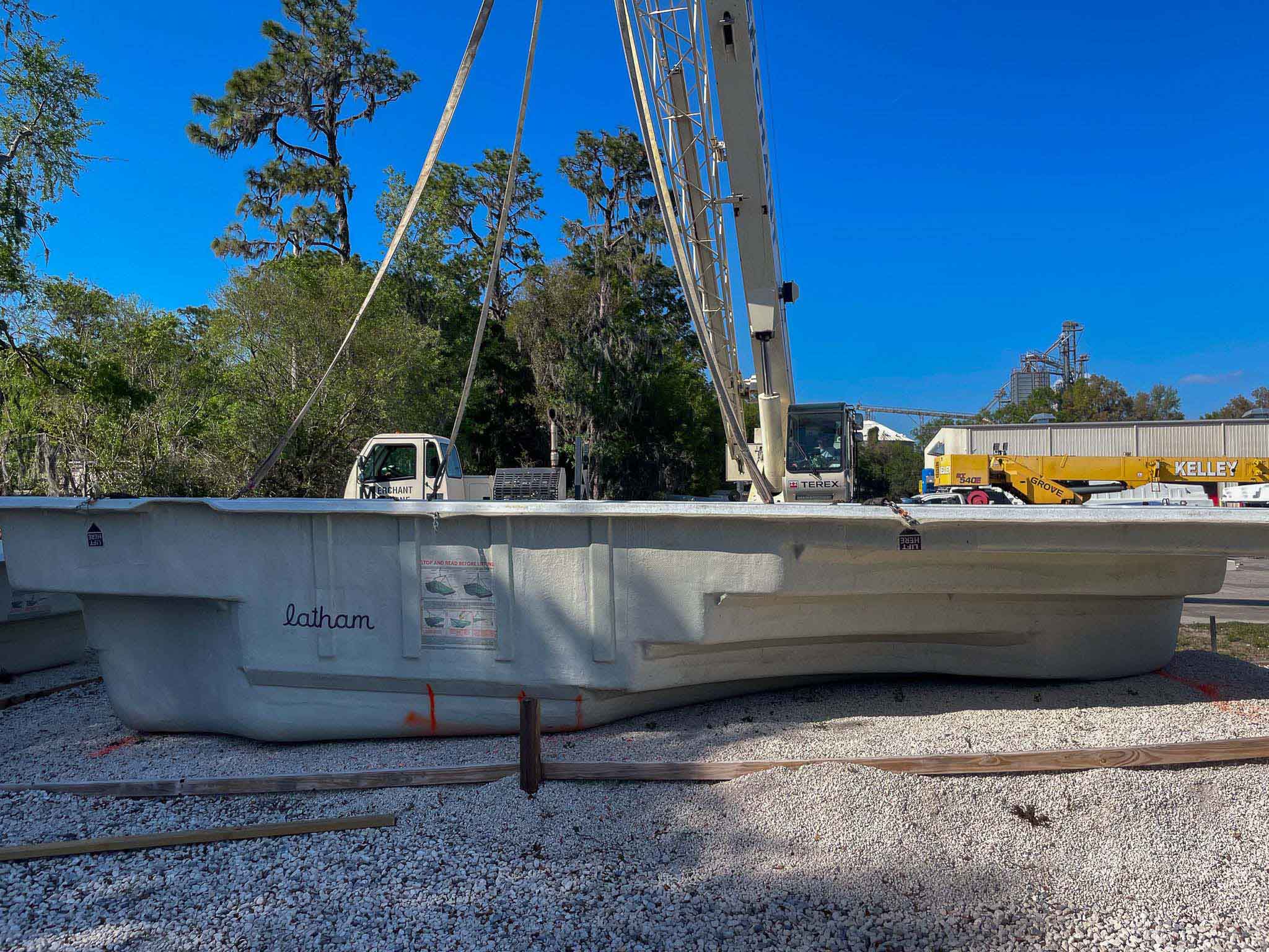 Fiberglass pool and Crane Preparing to Move Pool