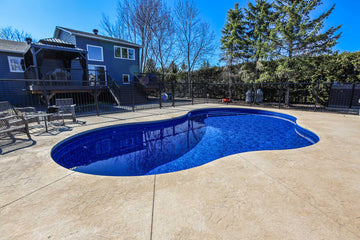 Freeform Inground Pool Installation in Sarsfield – Wide Concrete Patio