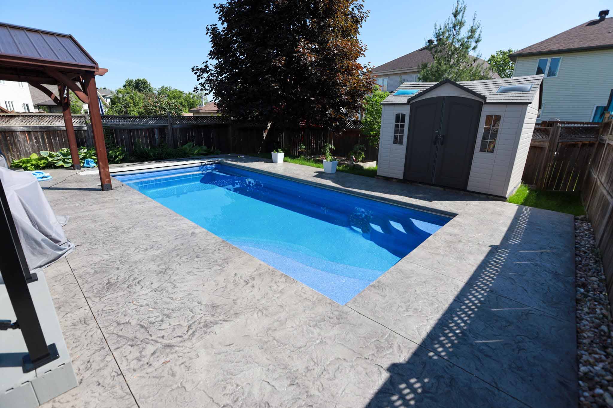 Newly Built Fiberglass Pool in Clarence-Rockland with Stamp Concrete