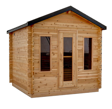 A small wooden sauna with natural wood log siding, a dark metal gabled roof, a glass-panelled front door, and two side windows, shown on a plain white background.