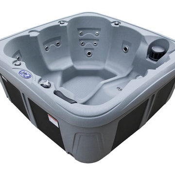 A plug-and-play, gray outdoor hot tub with multiple seating areas and built-in jets, shown on a plain white background.