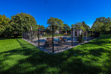 Inground free form pool construction with iron black fence