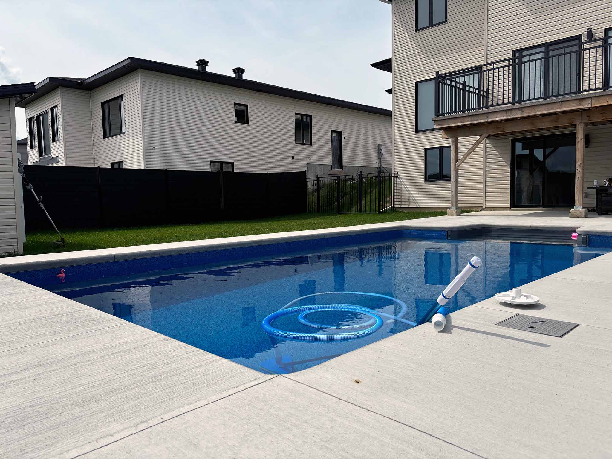 Pool view with vaccum on holding on corner