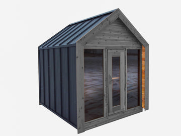 A small wooden Sauna with a dark gray metal roof, weathered gray wood exterior, and double glass doors, shown on a plain light gray background.