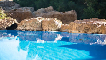 Natural rock edge inground pool | HB Pools