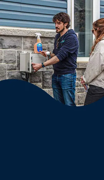 A pool technician explaining water chemistry and equipment settings during pool opening services | HB Pools