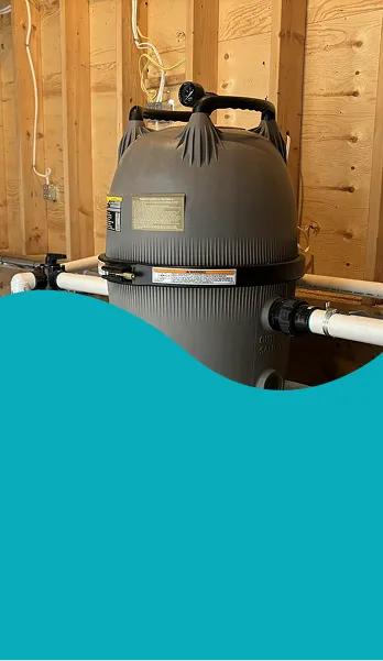 Monitoring a large grey pool cartridge filter as part of local pool opening services | HB Pools