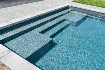 Rectangular pool with clear blue water on a sunny day | HB Pools