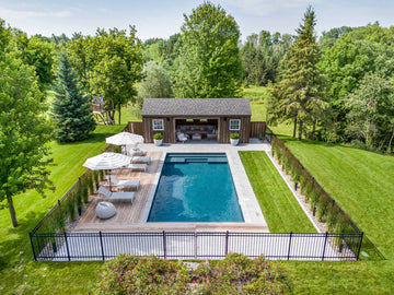 16x32 rectangular inground pool with sunledge and lounge chairs in St-Isidore backyard
